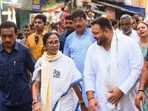 West Bengal Chief Minister and Trinamool Congress supremo Mamata Banerjee with RJD leader Tejashwi Yadav and others during a roadshow for the West Bengal Assembly elections, in Kolkata.