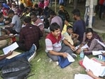 People, whose names were deleted from voters' lists in the ongoing SIR of electoral rolls in poll-bound West Bengal, queue up to present their cases before judicial officers, ahead of the state Assembly elections, at Krishnanagar. (PTI)