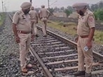 Police personnel at the blast site on the Rajpura-Shambhu railway line in Punjab’s Patiala district on Tuesday morning. (HT Photo)
