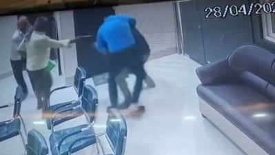 Krishna Bhushan Prasad (in blue shirt) attempted to overpower one of the assailants but was attacked by his accomplices. (Screengrab) Krishna Bhushan Prasad (in blue shirt) attempted to overpower one of the assailants but was attacked by his accomplices. (Screengrab)