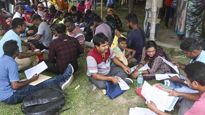 People, whose names were deleted from voters' lists in the ongoing SIR of electoral rolls in poll-bound West Bengal, queue up to present their cases before judicial officers, ahead of the state Assembly elections, at Krishnanagar. (PTI) People, whose names were deleted from voters' lists in the ongoing SIR of electoral rolls in poll-bound West Bengal, queue up to present their cases before judicial officers, ahead of the state Assembly elections, at Krishnanagar. (PTI)