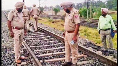 Police officials during an investigation at the Rajpura-Shambhu railway track in Patiala district on Tuesday. (PTI)