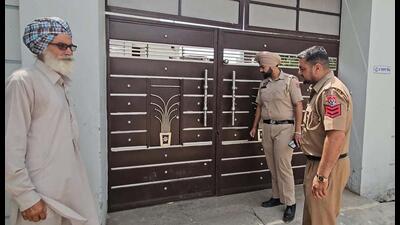 Police outside the house that was targeted by unidentified assailants at Roomi village in Ludhiana on Tuesday. (HT Photo)
