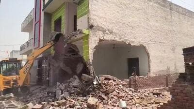 The house in Rampura village being razed on Tuesday. (HT) The house in Rampura village being razed on Tuesday. (HT)