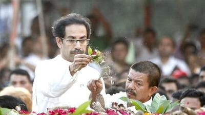 Uddhav Thackeray and Bal Thackeray's close aide Thapa perform the last rites during Sena chief's funeral at Shivaji Park in Mumbai. HT/Kunal Patil Uddhav Thackeray and Bal Thackeray's close aide Thapa perform the last rites during Sena chief's funeral at Shivaji Park in Mumbai. HT/Kunal Patil