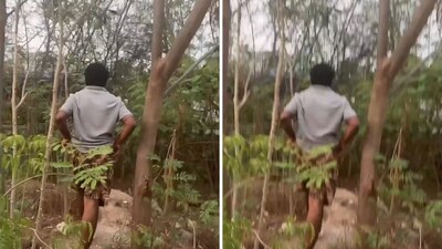 The woman could not capture the man's face on camera The woman could not capture the man's face on camera