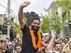 Aam Aadmi Party legislator Mehraj Malik waving to supporters in Jammu after his release from the Kathua jail on Tuesday. (PTI Photo)