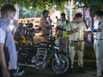 Delhi Police officials, along with Forensic Science Laboratory (FSL) teams, investigate the site on Ashok Road