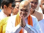 Home minister Amit Shah greets onlookers after voting during the Ahmedabad Municipal Corporation (AMC) elections (AFP FILE)