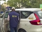 National Investigation Agency (NIA) personnel conduct searches at Jagaddal and Barrackpore police stations in connection with bomb recovery cases ahead of the polls, in Kolkata, (PTI)