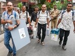 Polling officials leave after collecting Electronic Voting Machine (EVM) and Voter Verifiable Paper Audit Trail (VVPAT) units for voting in the second phase of the West Bengal Assembly elections. (PTI)