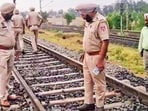 Police officials during an investigation at the Rajpura-Shambhu railway track in Patiala district on Tuesday. (PTI)