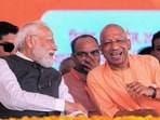 Prime Minister Narendra Modi interacts with UP chief minister Yogi Adityanath during the inauguration of the Ganga Expressway from Prayagraj to Meerut, in Hardoi district, on Wednesday. (AP Photo)