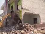 The house in Rampura village being razed on Tuesday. (HT)