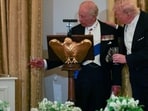 King Charles III presented Trump with a polished bell from the HMS Trump during a state dinner, symbolizing shared history. REUTERS/Suzanne Plunkett