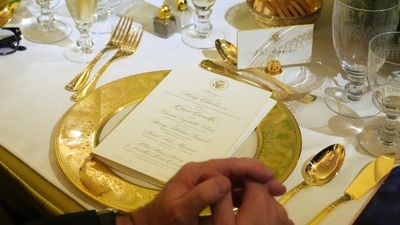 A table setting is seen as Britain's King Charles III speaks during a State Dinner with President Donald Trump, first lady Melania Trump and Queen Camilla in the East Room of the White House State Dinner Tuesday, April 28, 2026, in Washington. (AP Photo/Alex Brandon) (AP) A table setting is seen as Britain's King Charles III speaks during a State Dinner with President Donald Trump, first lady Melania Trump and Queen Camilla in the East Room of the White House State Dinner Tuesday, April 28, 2026, in Washington. (AP Photo/Alex Brandon) (AP)