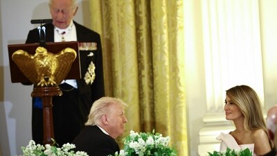 First Lady Melania Trump and US President Donald Trump smile as they listen to Britain's King Charles III speak during a State Dinner in the East Room of the White House in Washington, DC, on April 28, 2026. (Photo by Henry Nicholls / AFP) (AFP) First Lady Melania Trump and US President Donald Trump smile as they listen to Britain's King Charles III speak during a State Dinner in the East Room of the White House in Washington, DC, on April 28, 2026. (Photo by Henry Nicholls / AFP) (AFP)