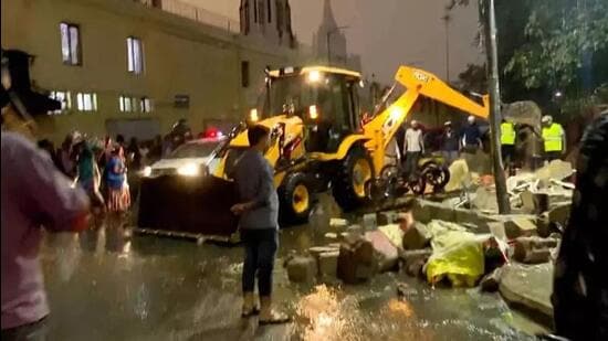 A compound wall of Bowring and Lady Curzon Hospital in Shivajinagar collapsed as heavy rain lashed parts of Bengaluru on Wednesday evening. (Screengrab/ ANI)