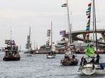 Boats of a new humanitarian flotilla bound for the Gaza Strip make a symbolic leave from Barcelona's Port Vell on April 12, 2026 as the departure of the flotilla has been postponed due to bad weather. (Photo by Josep LAGO / AFP)