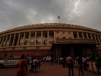Rain clouds cover the skyline above the Parliament House complex in New Delhi,