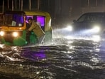 Bengaluru: Commuters make their way through a waterlogged Mysore Road following heavy rain, in Bengaluru, Wednesday, April 29, 2026.