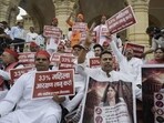 Samajwadi Party MLAs protest during the special session of UP assembly at Vidhan Bhawan in Lucknow on Thursday. (HT)
