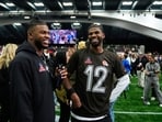 AFC quarterback Shedeur Sanders (12), of the Cleveland Browns, speaks with his brother Shilo Sanders AFC quarterback Shedeur Sanders (12), of the Cleveland Browns, speaks with his brother Shilo Sanders