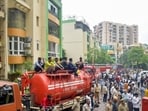 The fire at Gaur Green Avenue, a residential complex with 447 flats, left at least eight apartments completely gutted and four to six others damaged, according to officials. (Sakib Ali/HT Photo)