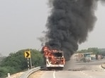 The ill-fated bus on fire on the Unnao–Lalganj highway on Wednesday (HT Photo) The ill-fated bus on fire on the Unnao–Lalganj highway on Wednesday (HT Photo)