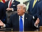 President Donald Trump speaks to reporters in the Oval Office of the White House,