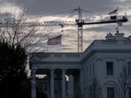 Cranes being used to construct the new White House ballroom are seen around the White House, April 4, in Washington.