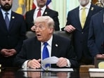 US President Donald Trump holds an event to sign an executive order in the Oval Office at the White House in Washington