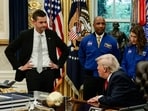 NASA Administrator Jared Isaacman listens while US President Donald Trump speaks during an event with Artemis II astronauts in the Oval Office at the White House in Washington, D.C.