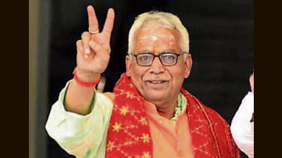BJP candidate Surya Kumar Sharma alias Arvind Sharma shows victory sign during filing of nomination for the Bihar Legislative Council by-Election at the Bihar Vidhan Sabha in Patna on Thursday. (Santosh Kumar/HT) BJP candidate Surya Kumar Sharma alias Arvind Sharma shows victory sign during filing of nomination for the Bihar Legislative Council by-Election at the Bihar Vidhan Sabha in Patna on Thursday. (Santosh Kumar/HT)