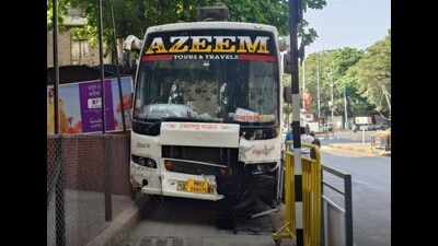 Following the collision, the bus veered off the road, climbed onto the footpath, and caused significant damage to the iron railing near Atre Auditorium. (HT PHOTO) Following the collision, the bus veered off the road, climbed onto the footpath, and caused significant damage to the iron railing near Atre Auditorium. (HT PHOTO)