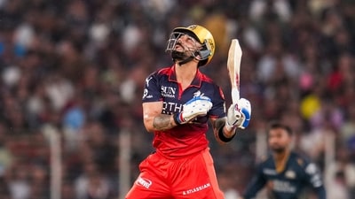 Virat Kohli started off in terrific touch – five fours in the second over off Kagiso Rabada, for 21 rus. He looked set to motor and get a big one, but was met by a pumped up Rabada as he was brought back – a bumper into the ribs, scooped up for an early GT wicket. (PTI) Virat Kohli started off in terrific touch – five fours in the second over off Kagiso Rabada, for 21 rus. He looked set to motor and get a big one, but was met by a pumped up Rabada as he was brought back – a bumper into the ribs, scooped up for an early GT wicket. (PTI)