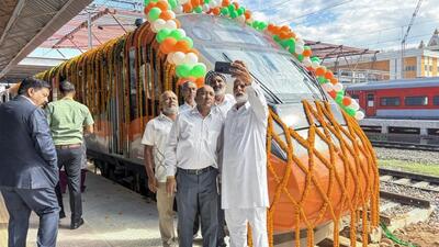 People taking a group selfie with the new Vande Bharat train in the background during the inauguration of the extended Srinagar-Katra Vande Bharat Express services between Jammu and Srinagar, in Jammu on Thursday. (ANI Photo) People taking a group selfie with the new Vande Bharat train in the background during the inauguration of the extended Srinagar-Katra Vande Bharat Express services between Jammu and Srinagar, in Jammu on Thursday. (ANI Photo)