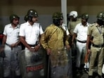 Security forces deployed at the gate of a strong room in Kolkata on Thursday. Security forces deployed at the gate of a strong room in Kolkata on Thursday.