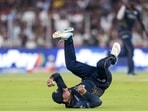 Gujarat Titans’ Rashid Khan takes the catch of Royal Challengers Bengaluru's Virat Kohli. (PTI)