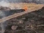 Smoke rises amid burned areas at a military base in Hombori, Mali, in this still image obtained from an undated social media video released April 30, 2026.