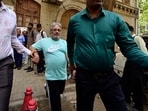 NCB officials escort Dawood Ibrahim's close aide Salim Dola for medical at NCB office in Ballard Estate in Mumbai.
