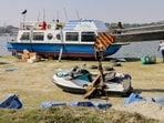 Workers prepare a cruise ship, ahead of the launch of cruise service on Yamuna river, in New Delhi.