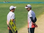 Shubman Gill with head coach Gautam Gambhir stands near the pitch during a training session.