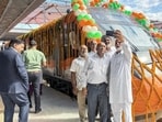 People taking a group selfie with the new Vande Bharat train in the background during the inauguration of the extended Srinagar-Katra Vande Bharat Express services between Jammu and Srinagar, in Jammu on Thursday. (ANI Photo)