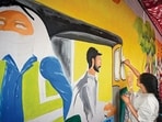 Residents from east Delhi's Sunder Nagri make a mural about the impacts of extreme heat on workers (Sanchit Khanna/ HT)