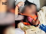 A woman with a child found dead after a cruise boat overturned in the Bargi Dam due to a sudden storm, in Jabalpur district, Madhya Pradesh, Friday, May 1, 2026. 
