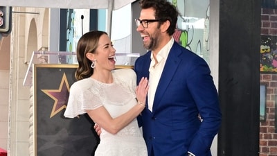 Emily Blunt turned the ceremony into a family affair as she posed with her husband, The Office's John Krasisnki, laughing together in a heartfelt embrace. (AFP) Emily Blunt turned the ceremony into a family affair as she posed with her husband, The Office's John Krasisnki, laughing together in a heartfelt embrace. (AFP)