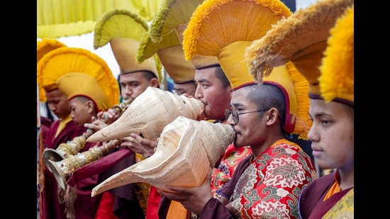Buddhist monks blow ceremonial conch shells during a special prayer ceremony on the occasion of Buddha Purnima at Dorje Drak Monastery, in Shimla, on Friday. (PTI)