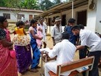 People arrive to cast their vote for the Kerala assembly election.