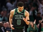 Jayson Tatum #0 of the Boston Celtics celebrates a three point basket against the Philadelphia 76ers during the second quarter